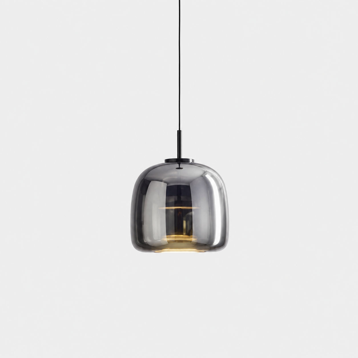 The Capsule, mirror-finish smoked glass pendant light around a machined metal core — Selden Home product photography