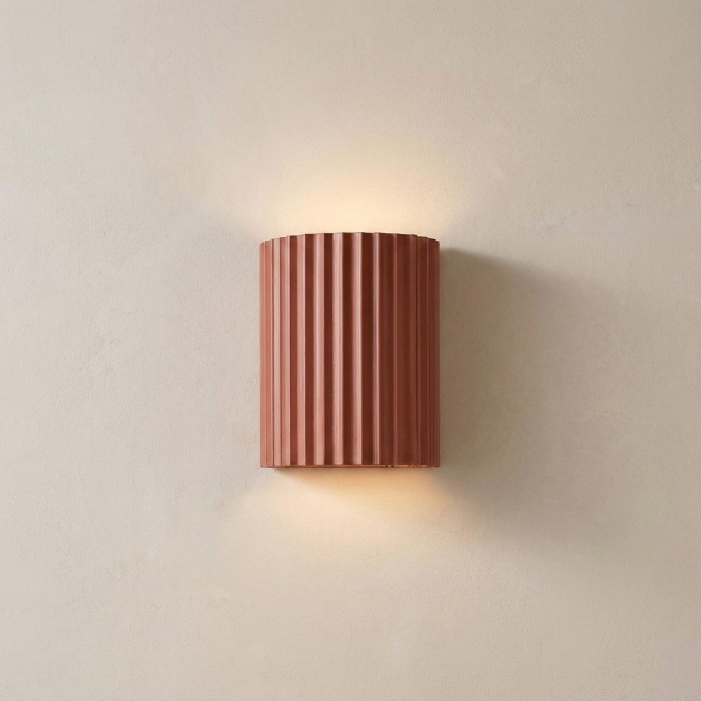 The Pleat, terracotta fluted wall light in situ on lime-washed plaster wall — Selden Home product photography