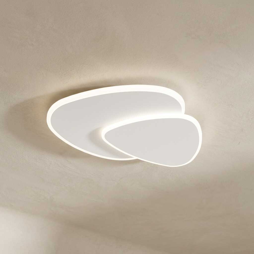 The Facet white flush-mount ceiling light, lit, against a lime-washed plaster ceiling — Selden Home product photography