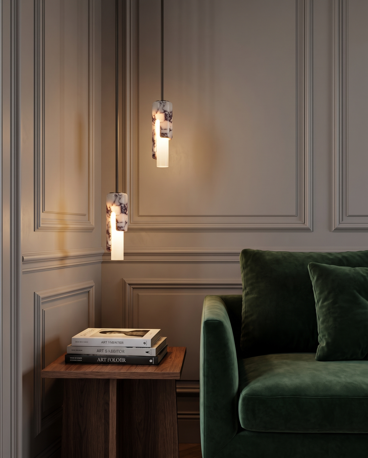 Two Flute pendants at different heights beside a green velvet armchair