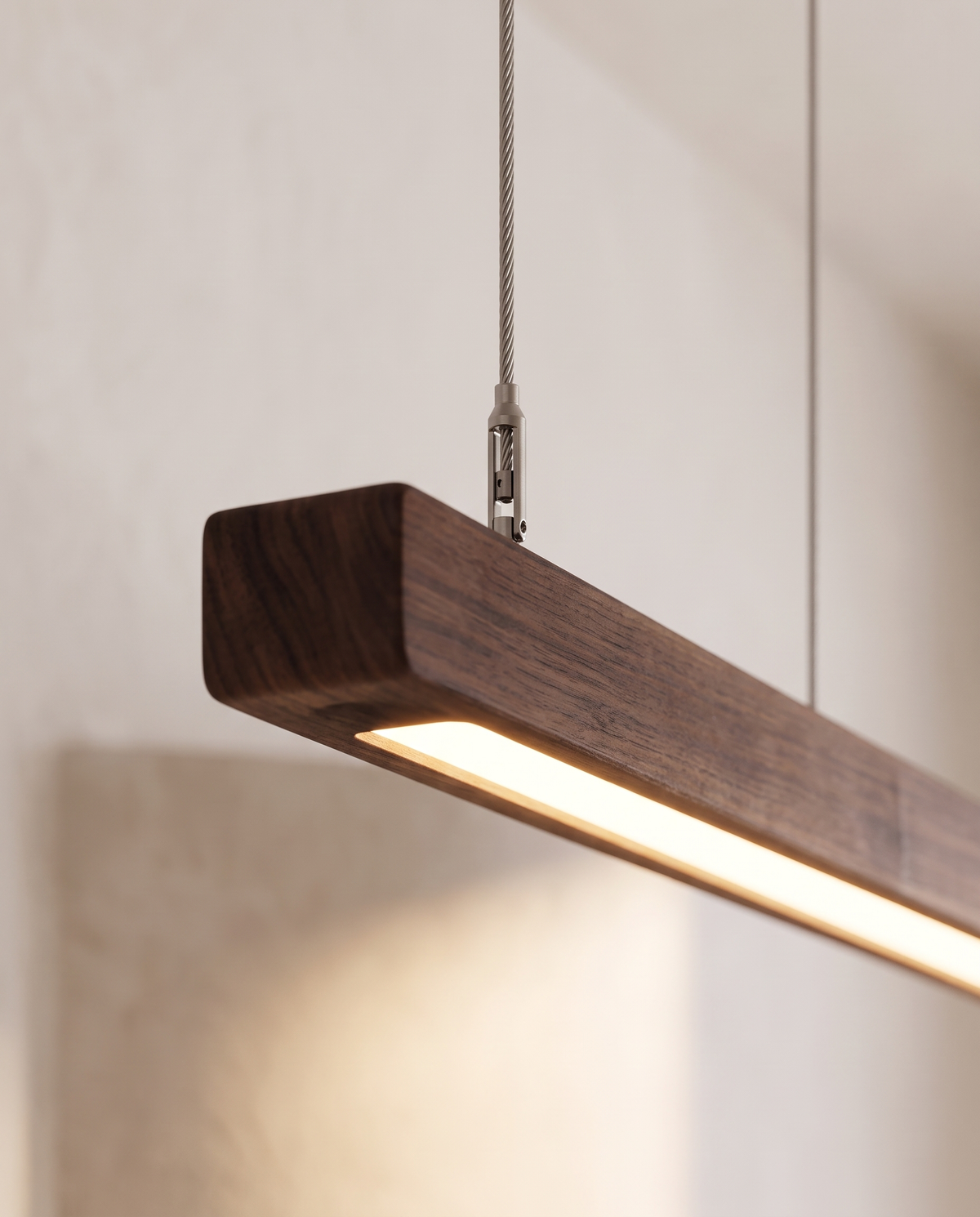 Close-up of the end of The Joist's wood bar and its lit diffuser