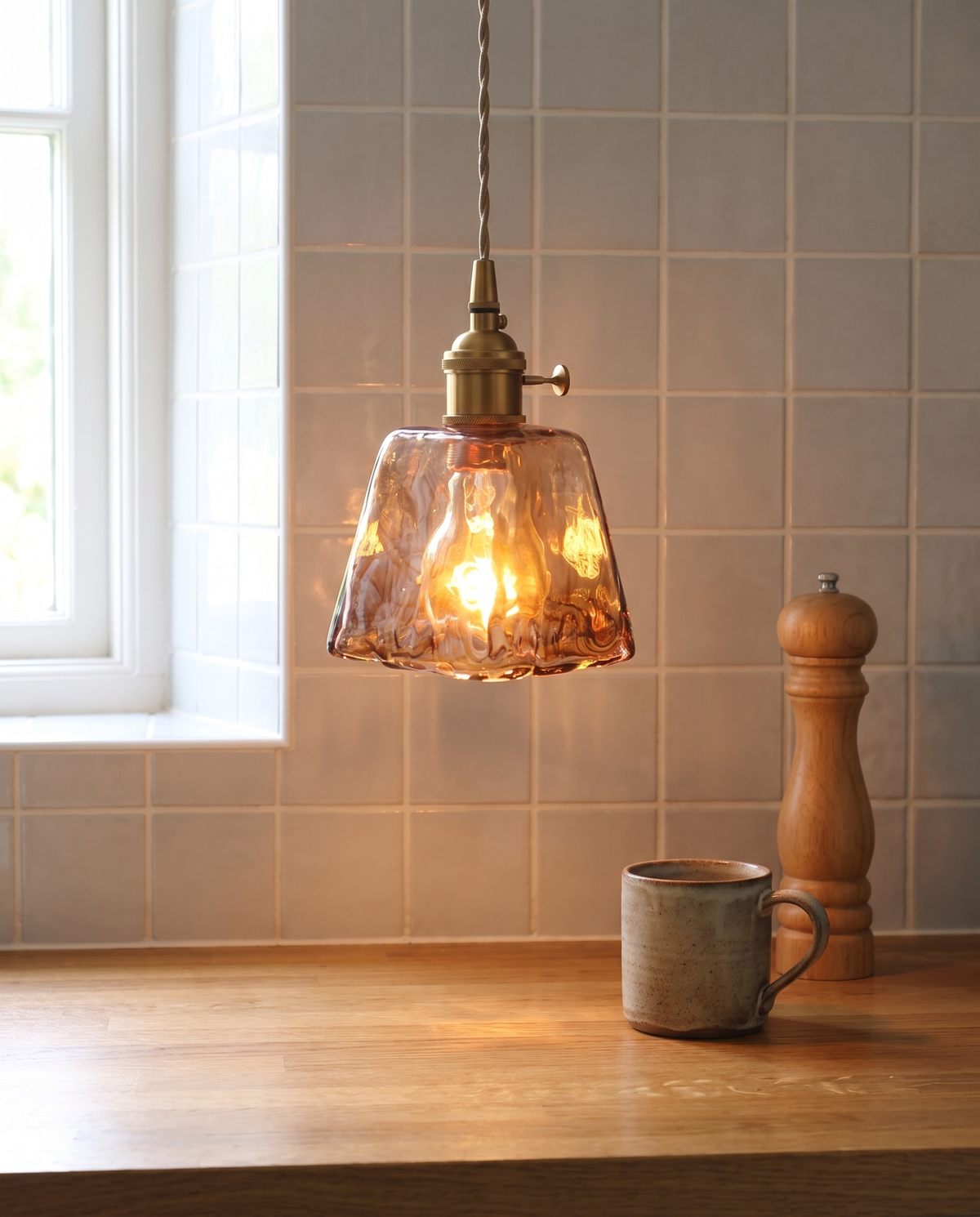 The Tumbler Pendant – Bell beside a mug and pepper mill, showing its size