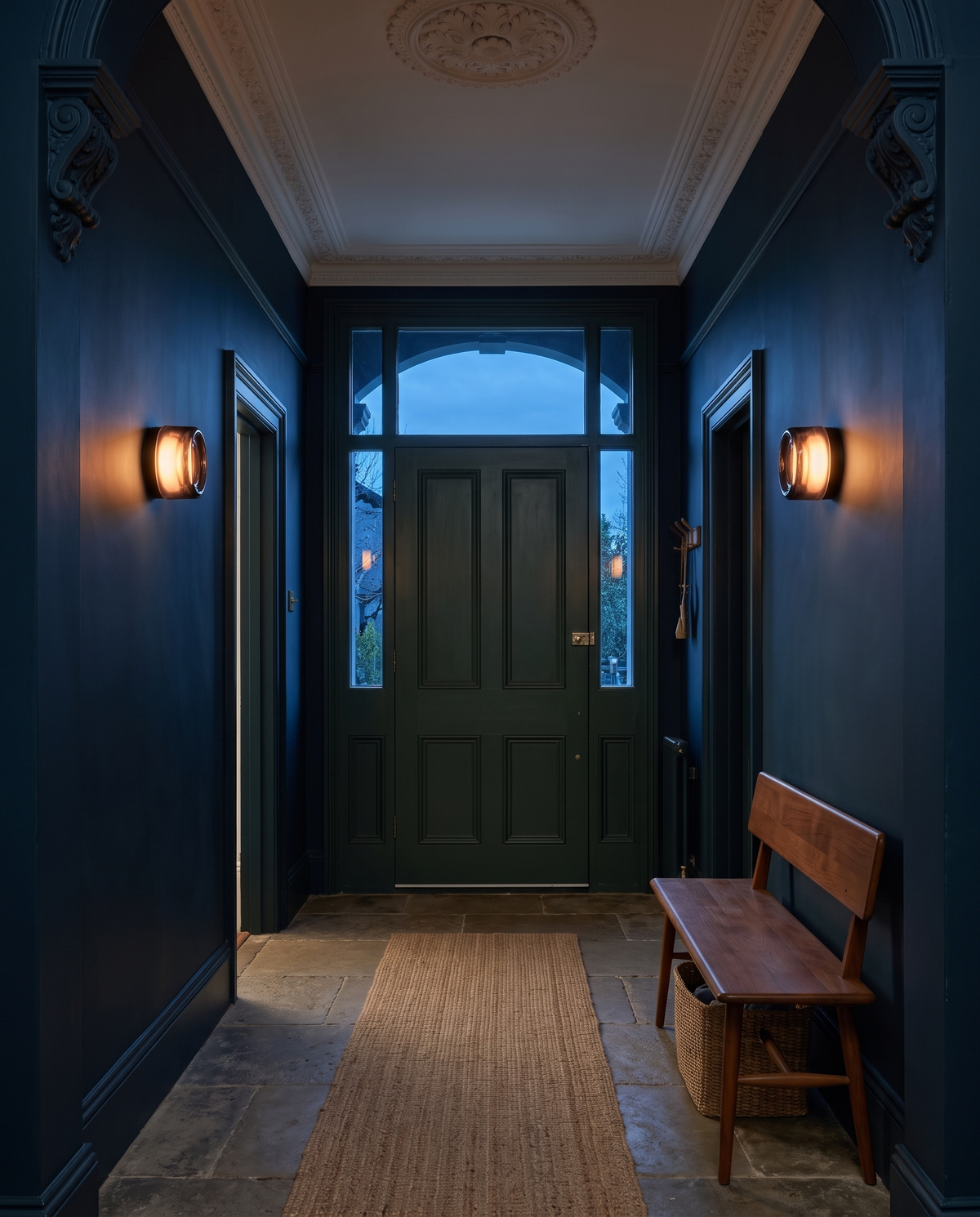 The Halo glass wall light – Entrance hall at dusk, renovated Victorian terrace