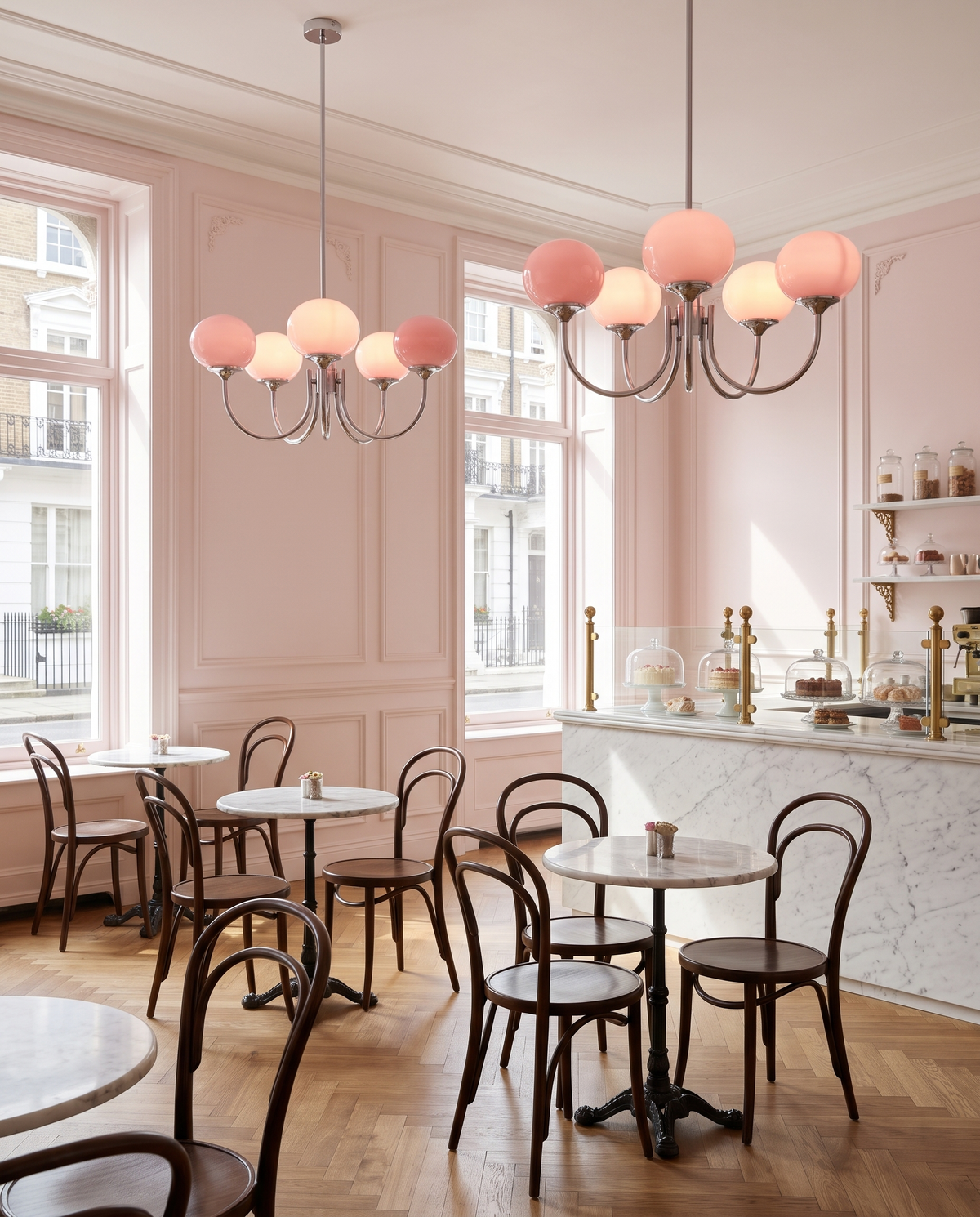 Two Bonbon chandeliers in Chrome & Rose in a Marylebone patisserie