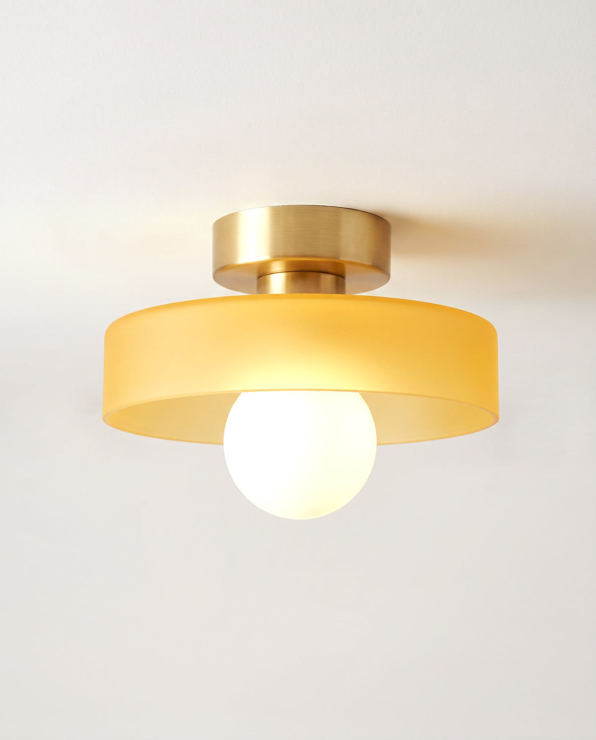 The Cloche Ceiling Light in Brass & Honey