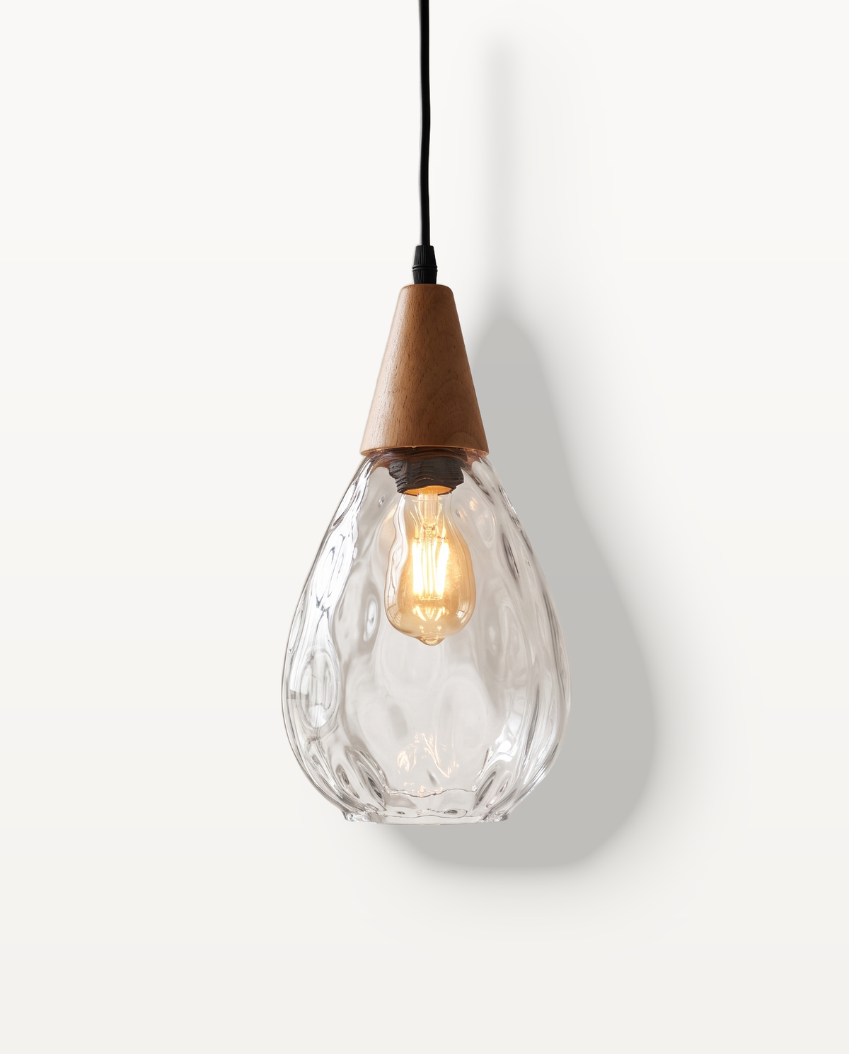 The Dew Pendant, clear textured glass, 20 cm, lit
