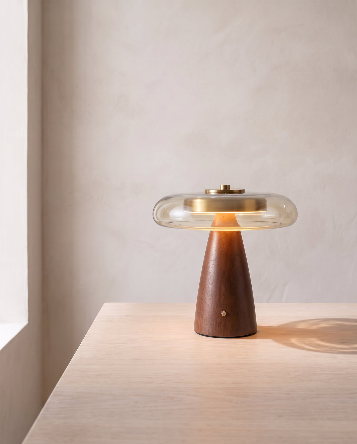 The Dovetail Table Lamp in side profile, lit