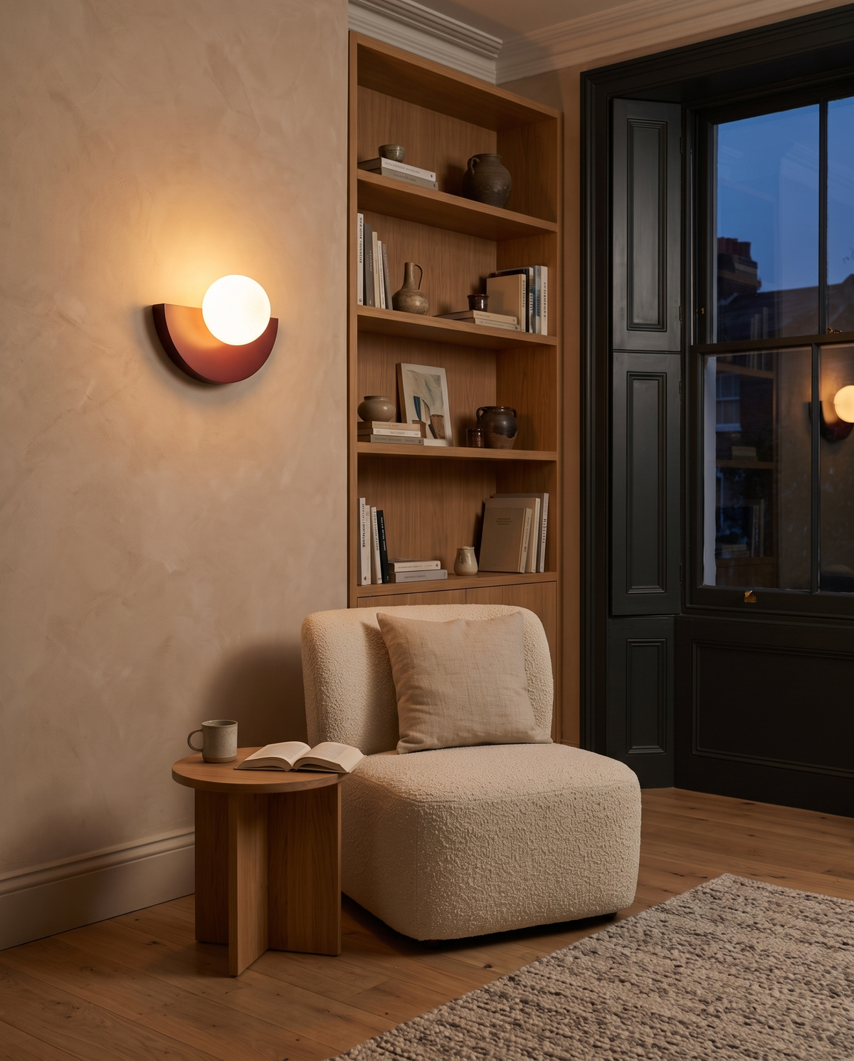 The Fanlight in Oxblood above an armchair in a living room