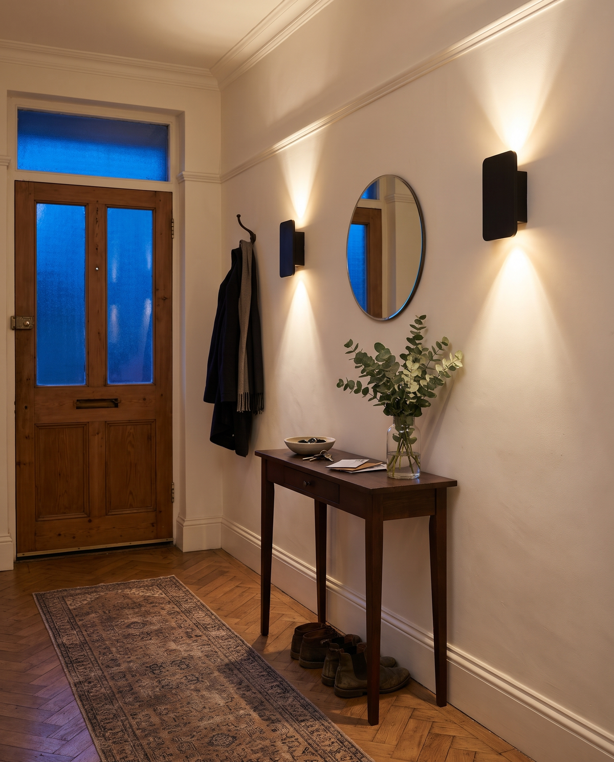 Two Folio wall lights in Jet in the hallway of a 1930s semi