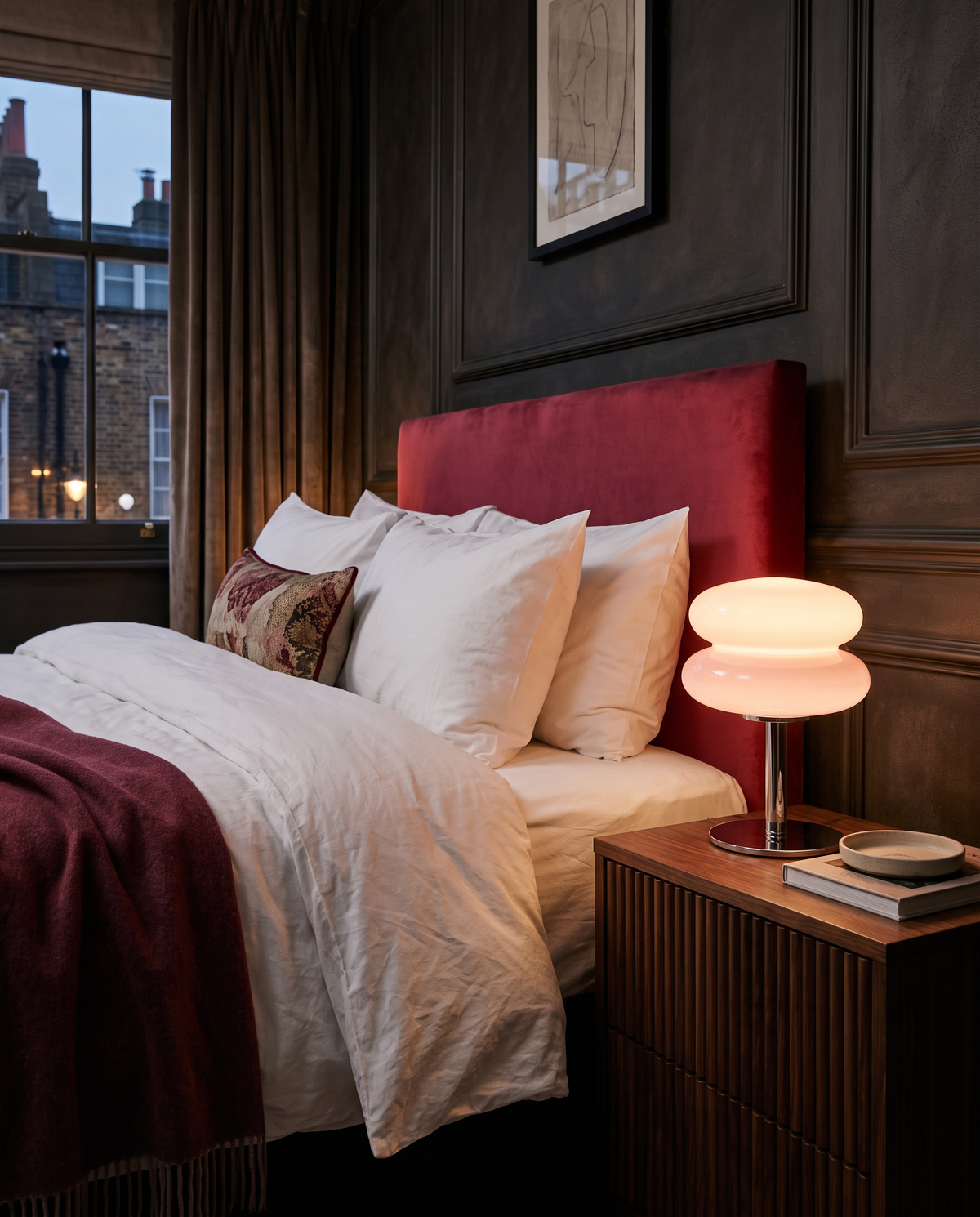 The Fondant in Blush on a bedside table in a boutique hotel room