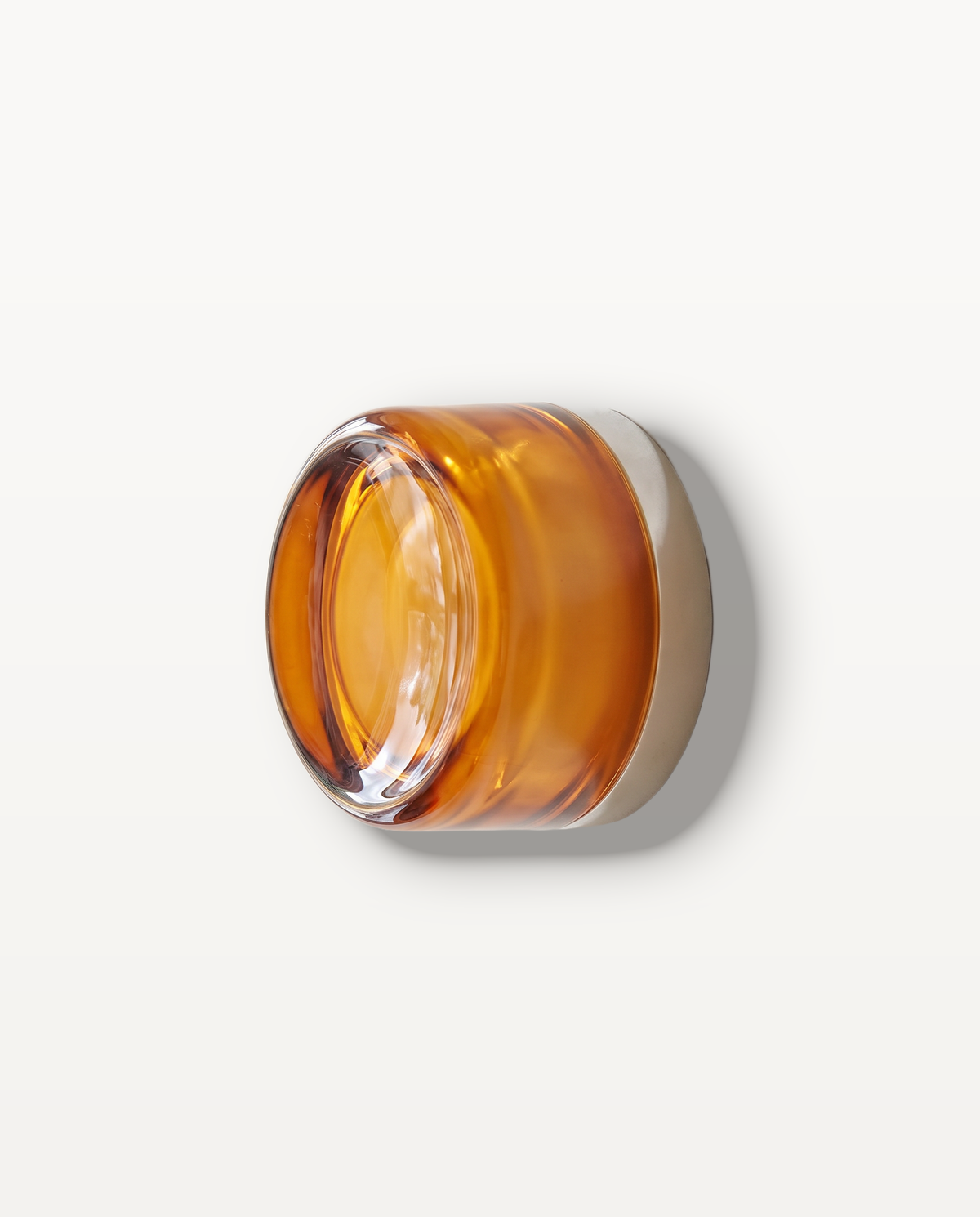 The Halo Wall Light – Ember, bright amber glass, pale collar, round solid pressed-glass wall light