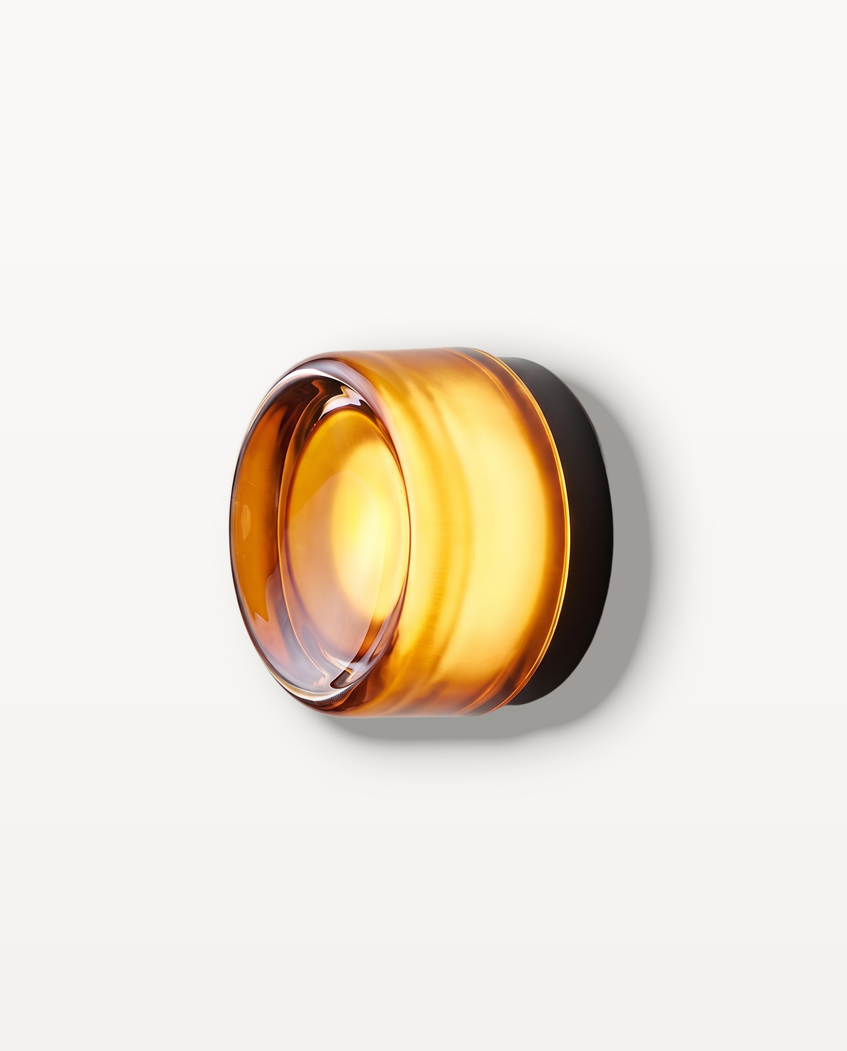 The Halo Wall Light – Onyx, amber glass, black collar, round solid pressed-glass wall light