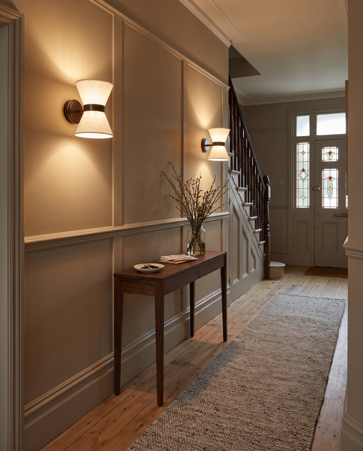 Two Hourglass wall lights along an Edwardian hallway