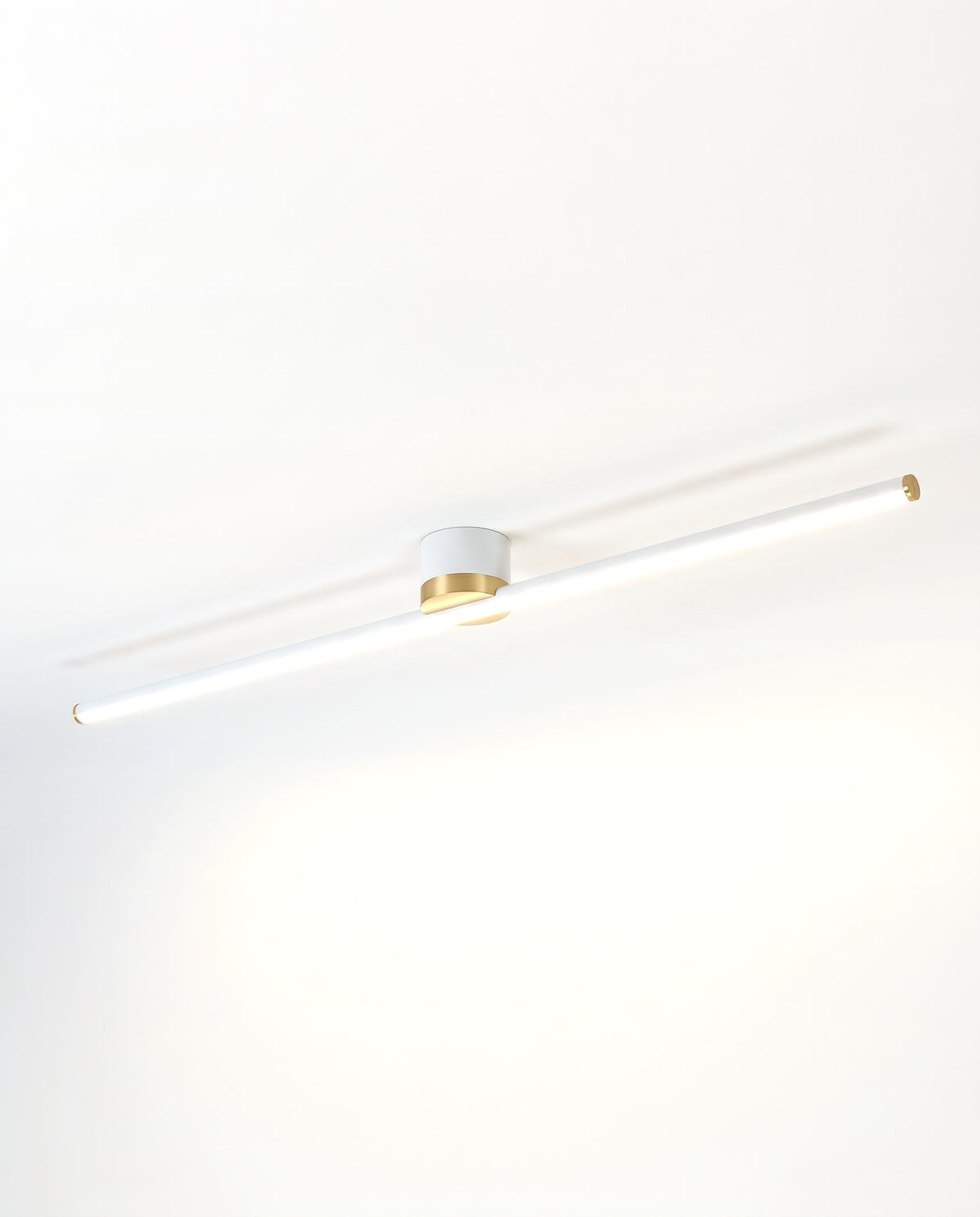 The Lath Ceiling Light in Chalk with a brass-coloured band, as a downlight