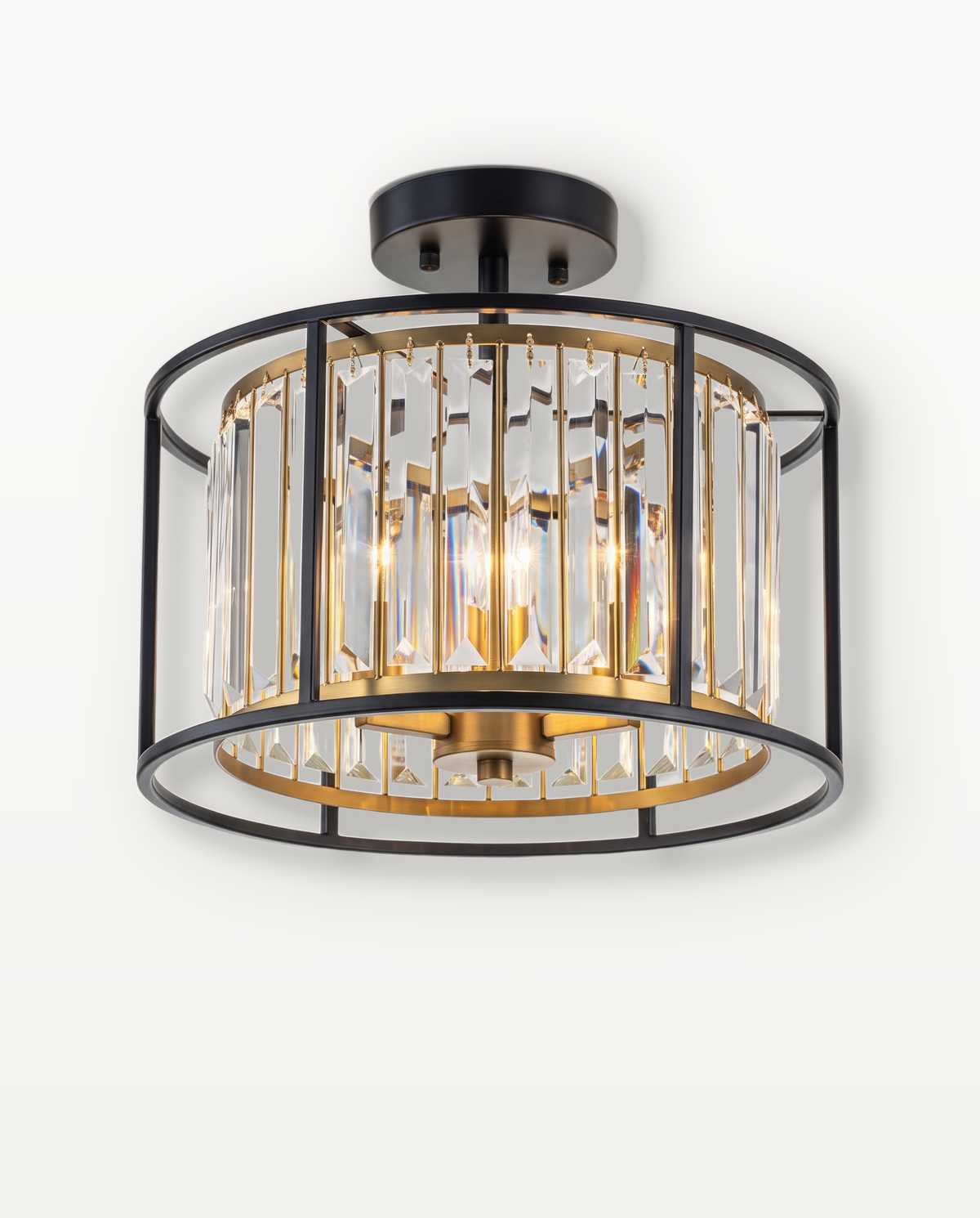 The Lustre Ceiling Light, crystal prisms in an open black and brass drum, lit