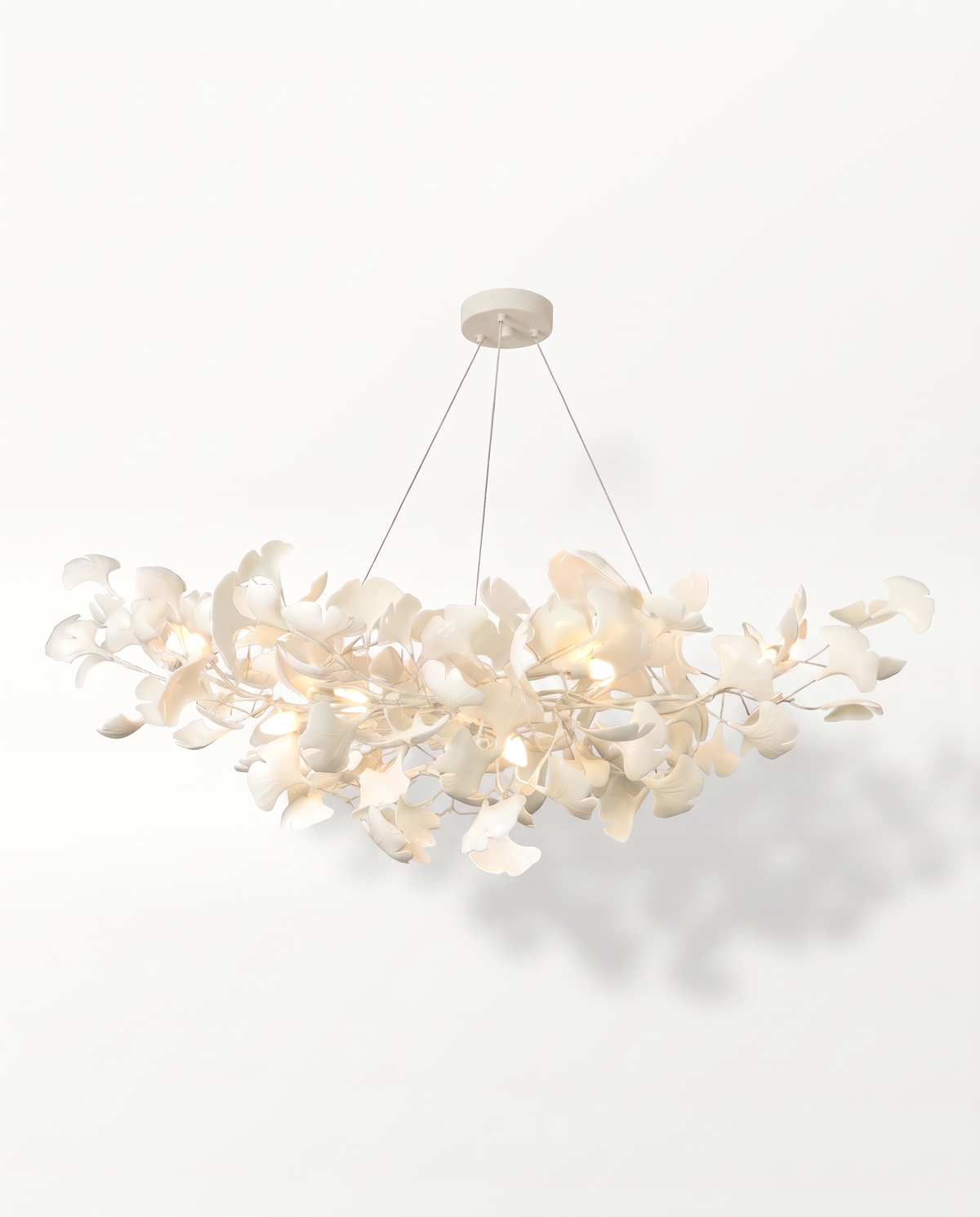 The Maidenhair Chandelier in Chalk, all white with porcelain leaves
