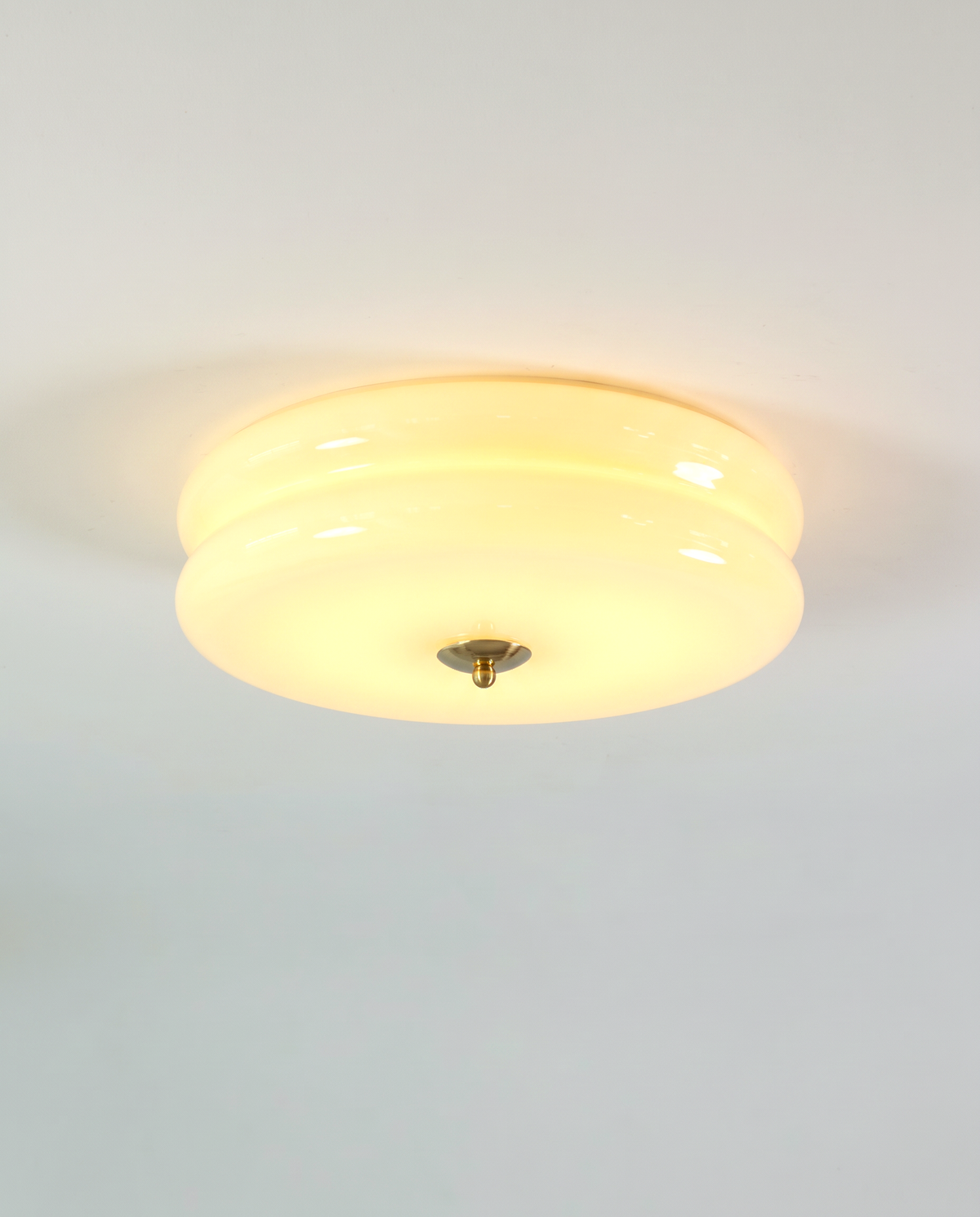 The Odeon Ceiling Light in Custard glass with a gilt finial