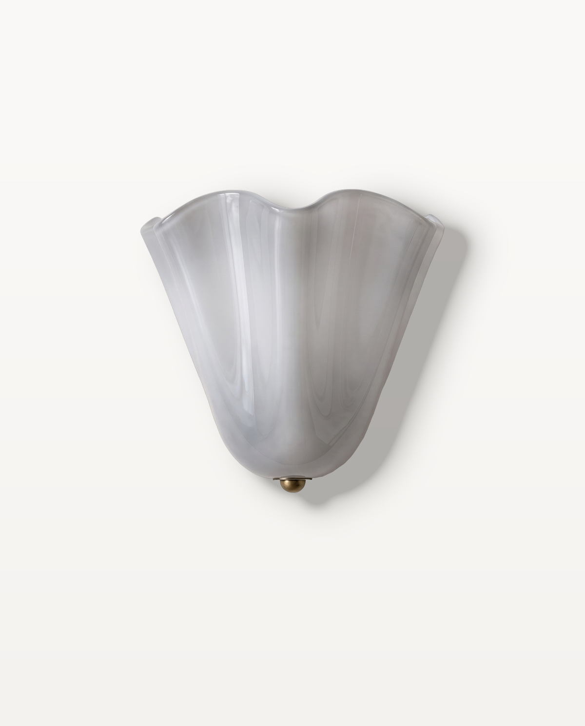 The Petal Wall Light – Mist, sculpted cool misty white glass petal shade with a brass tip