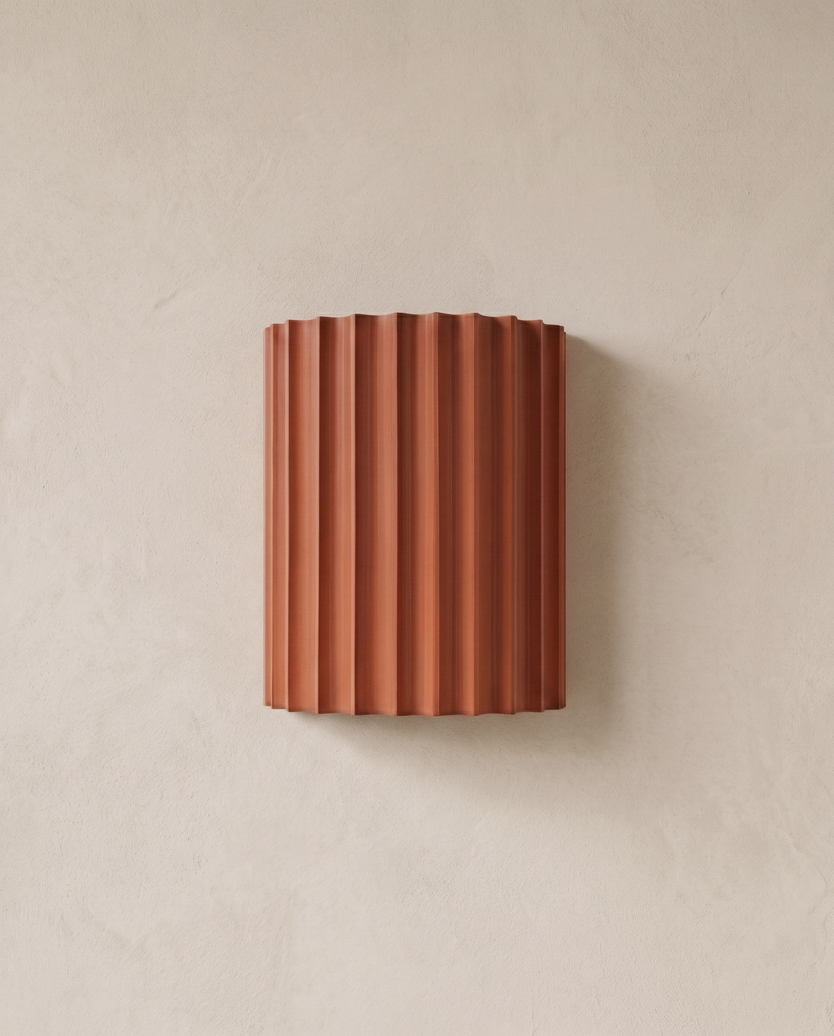 The Pleat, terracotta fluted wall light on lime-washed plaster wall — Selden Home product photography