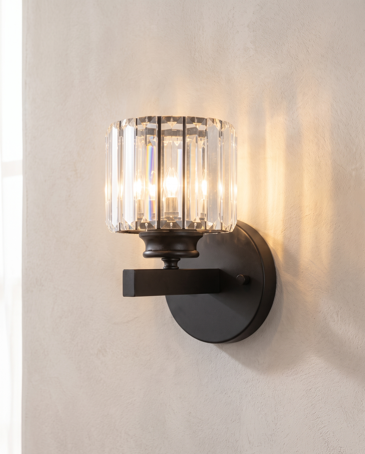 The Prism black art deco crystal wall sconce, close-up detail of faceted K9 crystal — Selden Home product photography