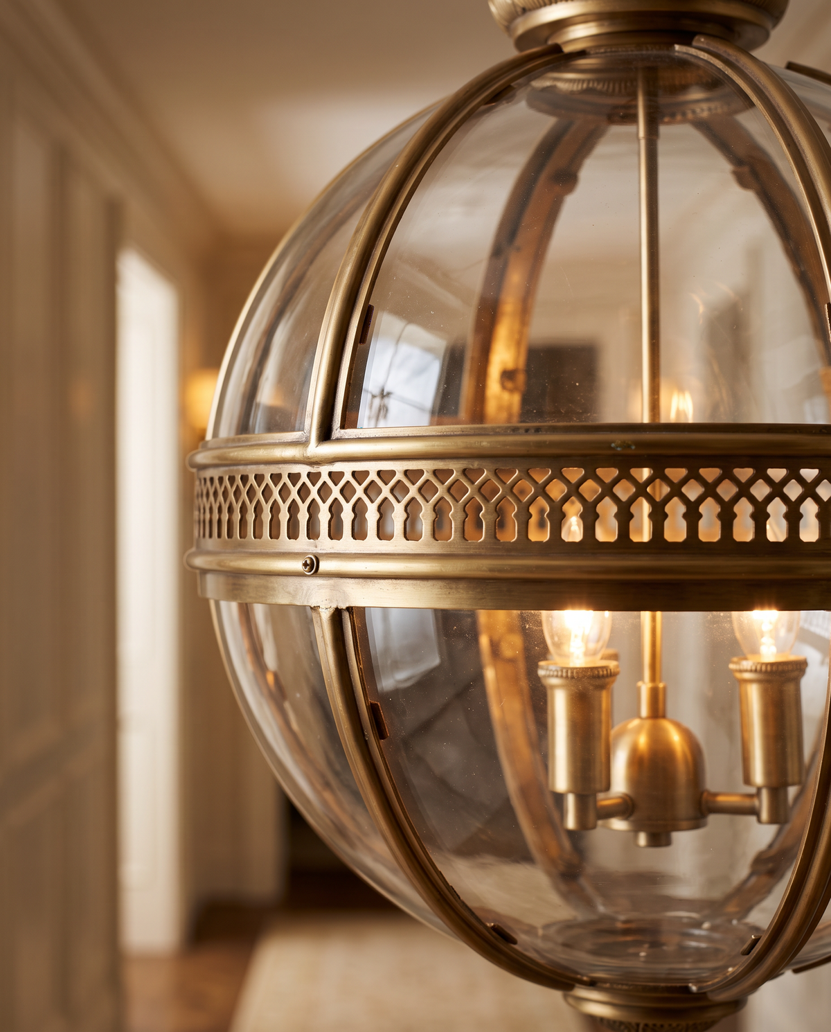 Close-up of the pierced antique gold band and candle bulbs of The Regent