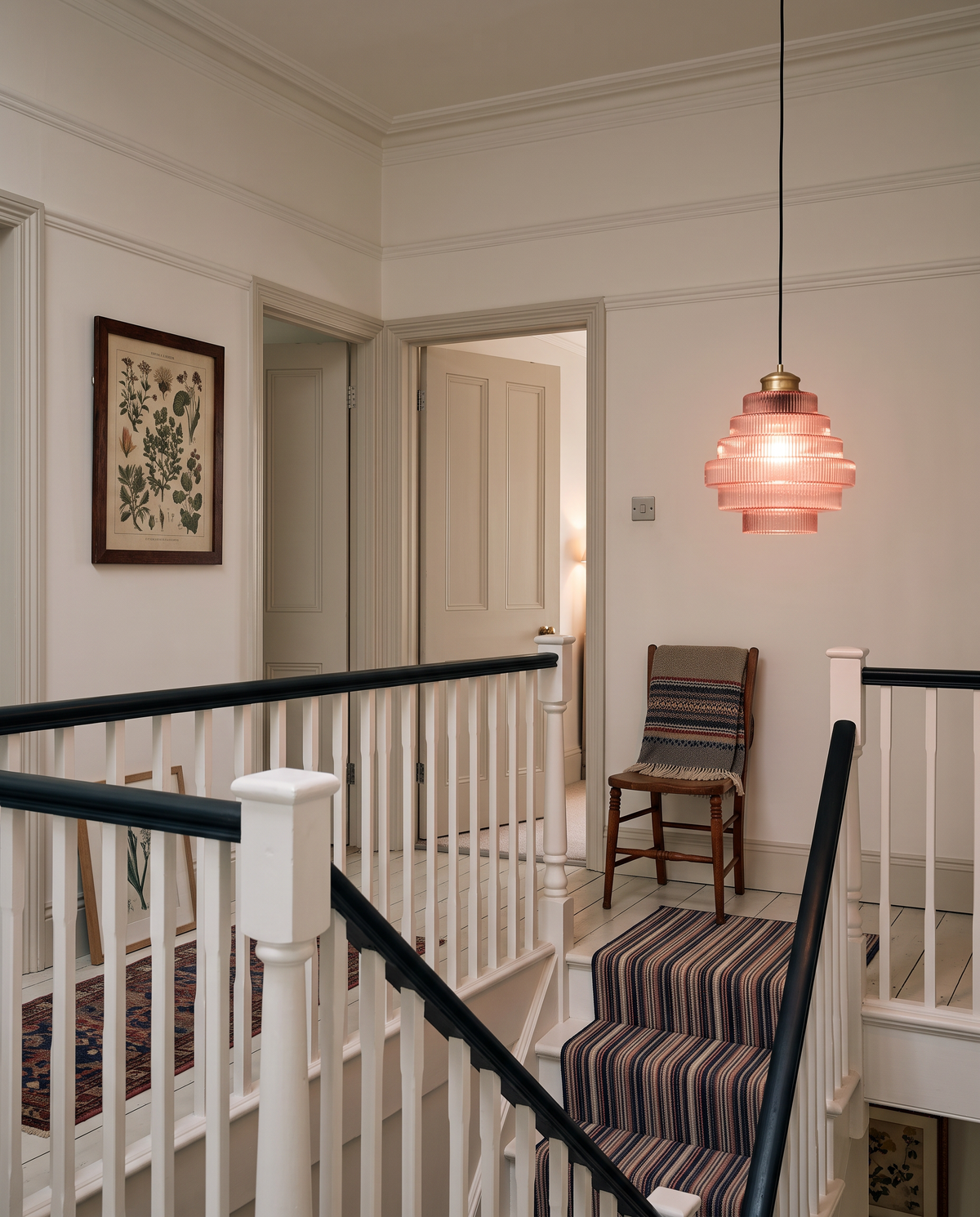A Skep in Rose over the stairwell of an Edwardian landing