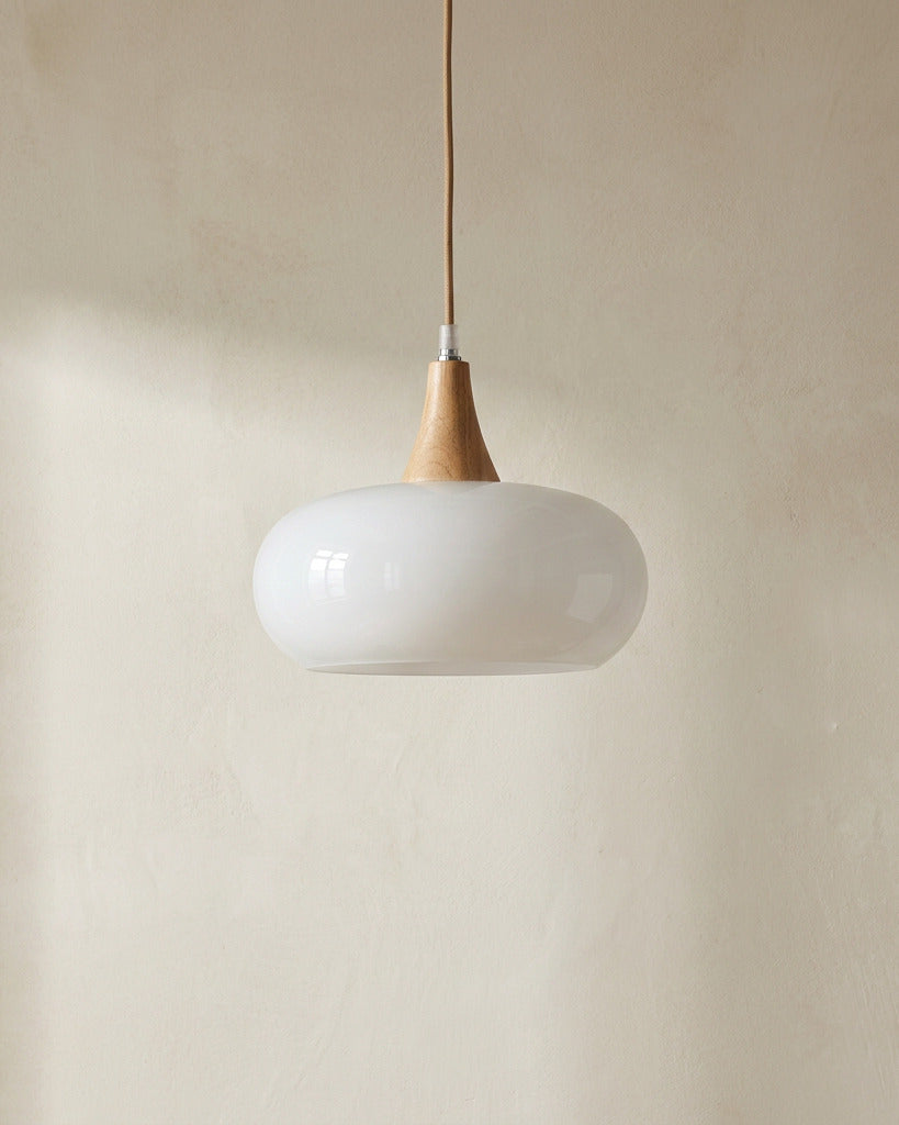 The Grove, wood and white glass pendant light, hanging against plaster wall — Selden Home product photography
