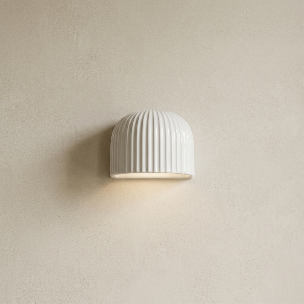 White fluted wall light on a lime-washed plaster wall — Selden Home