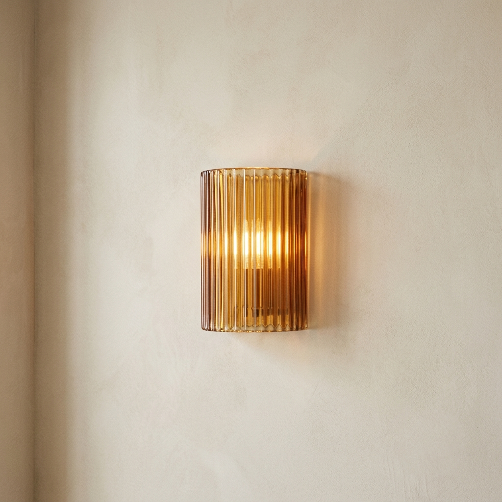 Ribbed amber glass wall sconce, lit — Selden Home