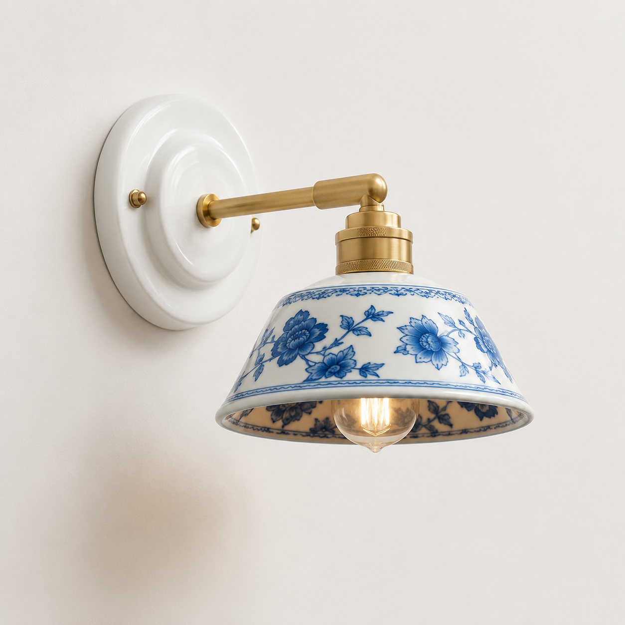 The Delft, hand-painted indigo ceramic wall light on a solid brass arm — Selden Home product photography