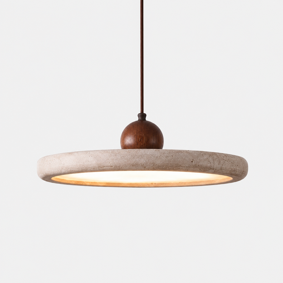 The Aperture, travertine ring pendant with a turned wood sphere and LED halo — Selden Home product photography
