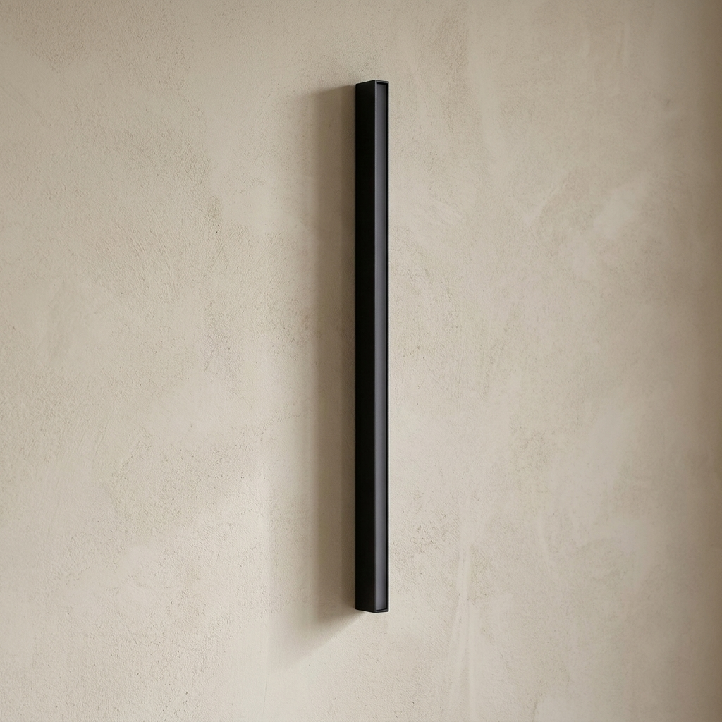 The Beacon black outdoor wall light, unlit, on a lime-washed plaster wall — Selden Home product photography