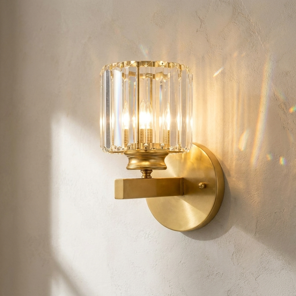 The Prism gold art deco crystal wall sconce, lit, mounted on a lime-washed plaster wall — Selden Home product photography