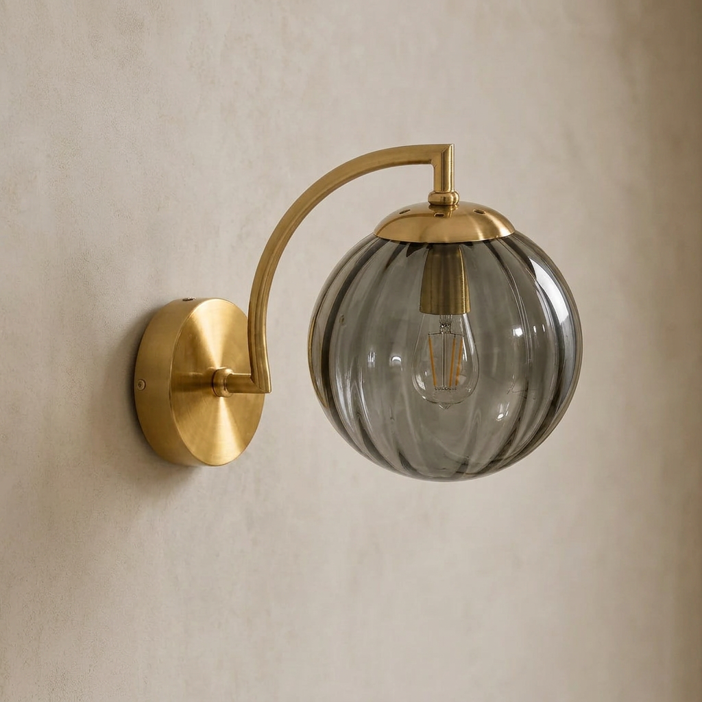 The Bloom, ribbed glass wall sconce, smoke grey glass on gold arm, mounted on plaster wall — Selden Home product photography