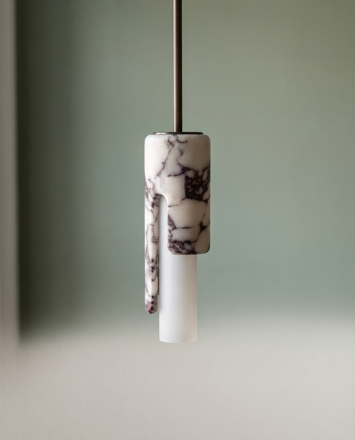 The Flute Pendant switched off, showing the marble veining