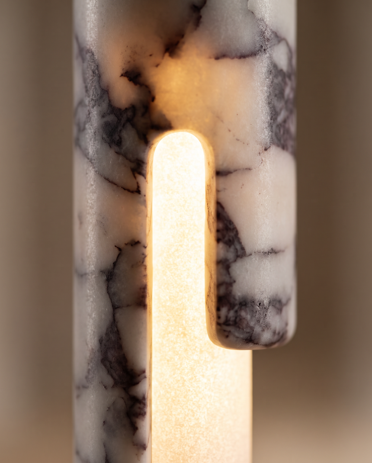 Close-up of the lit slot in The Flute's marble cylinder