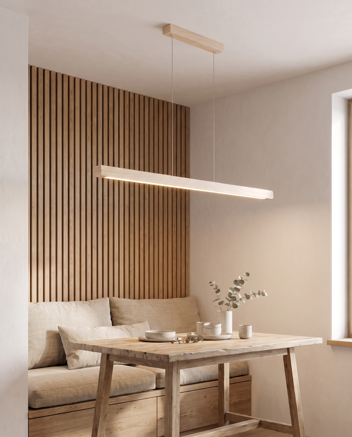 The Joist Pendant in light wood over a table in a japandi dining nook