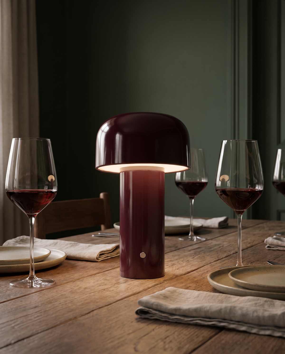 The Bud lamp in burgundy on a set dining table