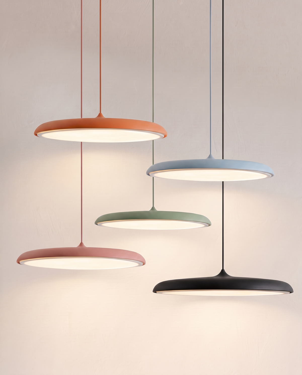 Five Wafer pendants in orange, blue, green, pink and black hung together