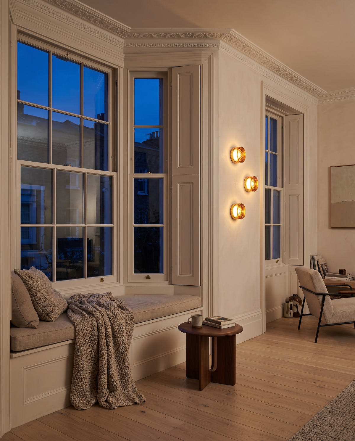 The Halo glass wall light – Front sitting room bay window at dusk, renovated Georgian townhouse