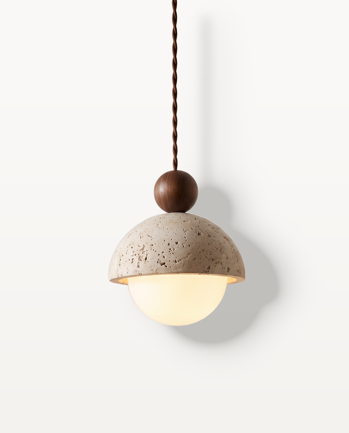 The Acorn Pendant, travertine dome, opal glass globe and Conker bead, lit