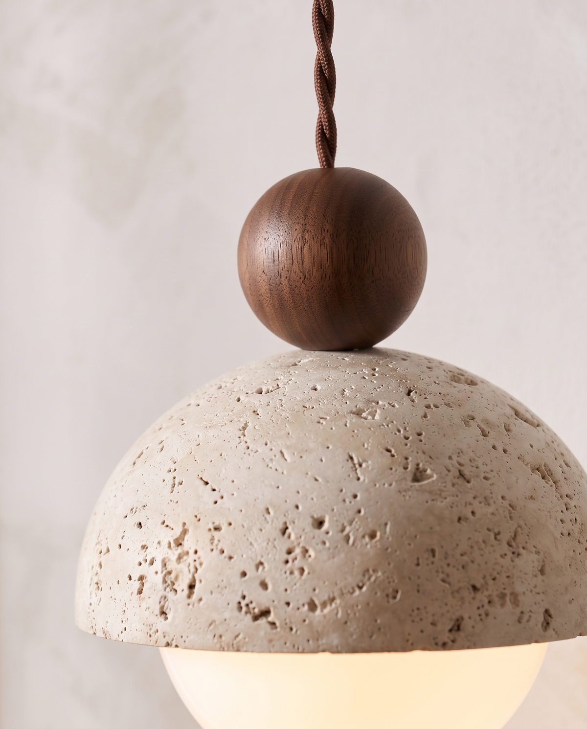 Close-up of the wooden bead on the travertine dome of The Acorn