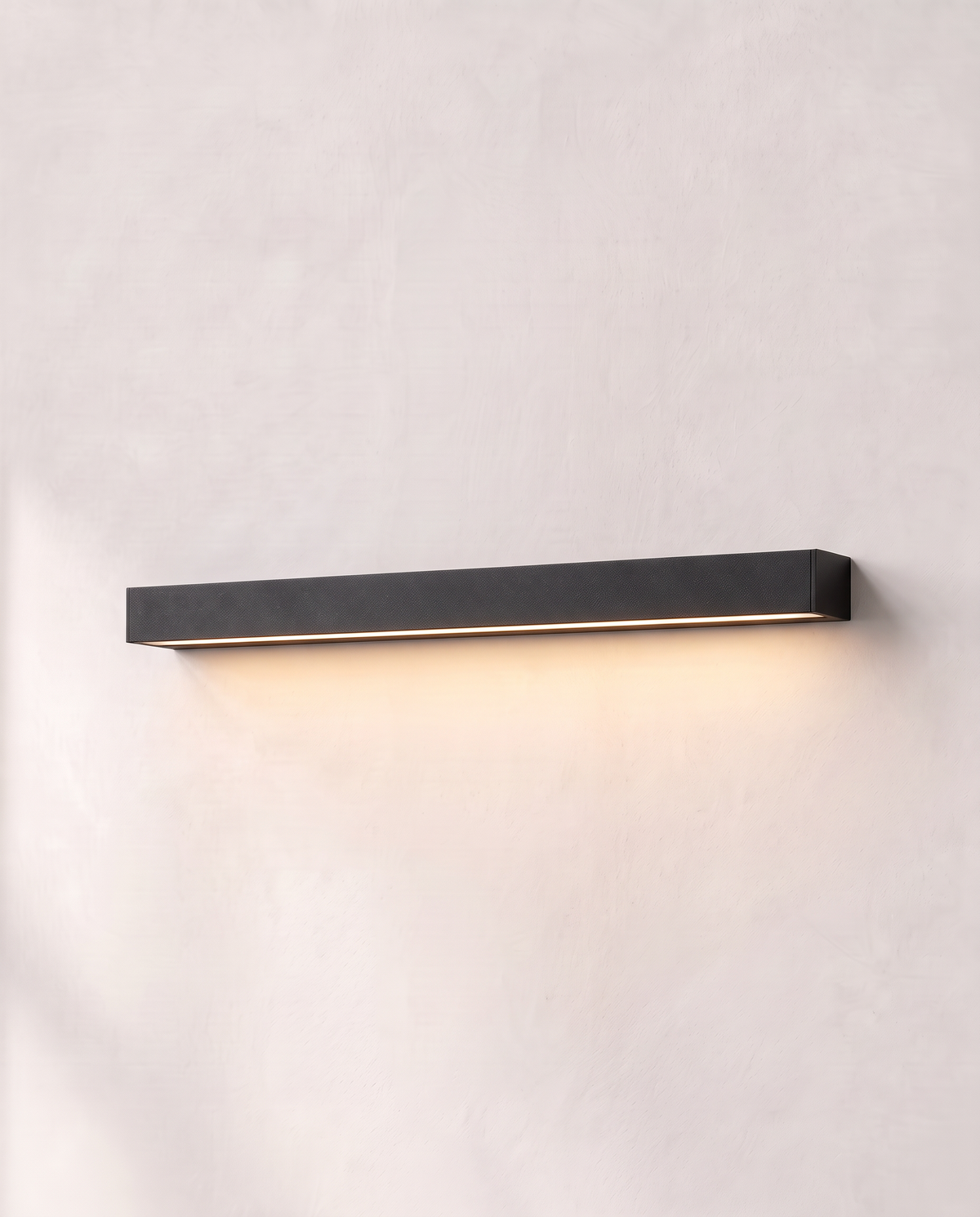 The Beacon mounted horizontally, its light washing down the wall