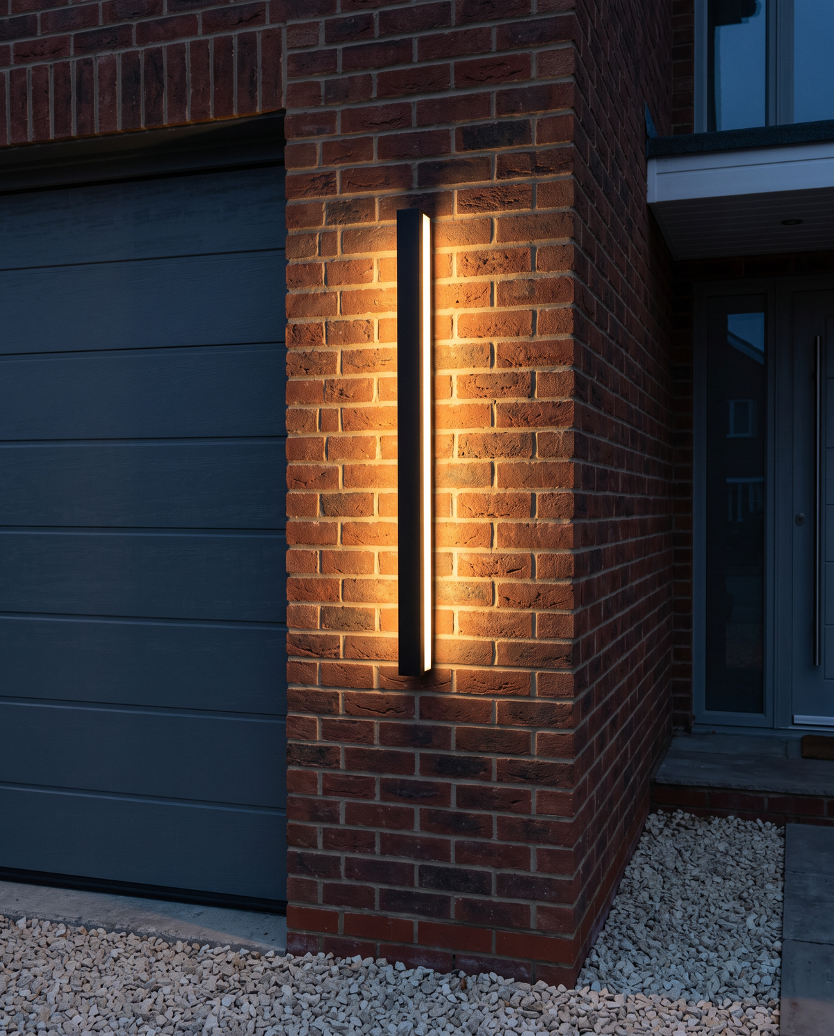 The Beacon beside a garage door on a brick house