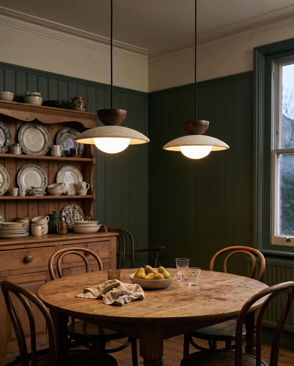 A pair of Brims over a round oak table in a Victorian kitchen-diner
