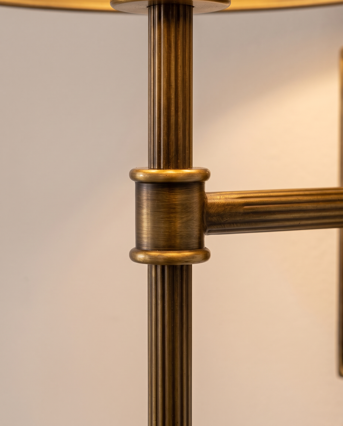 Close-up of the fluted antiqued brass rod and collar of The Bureau