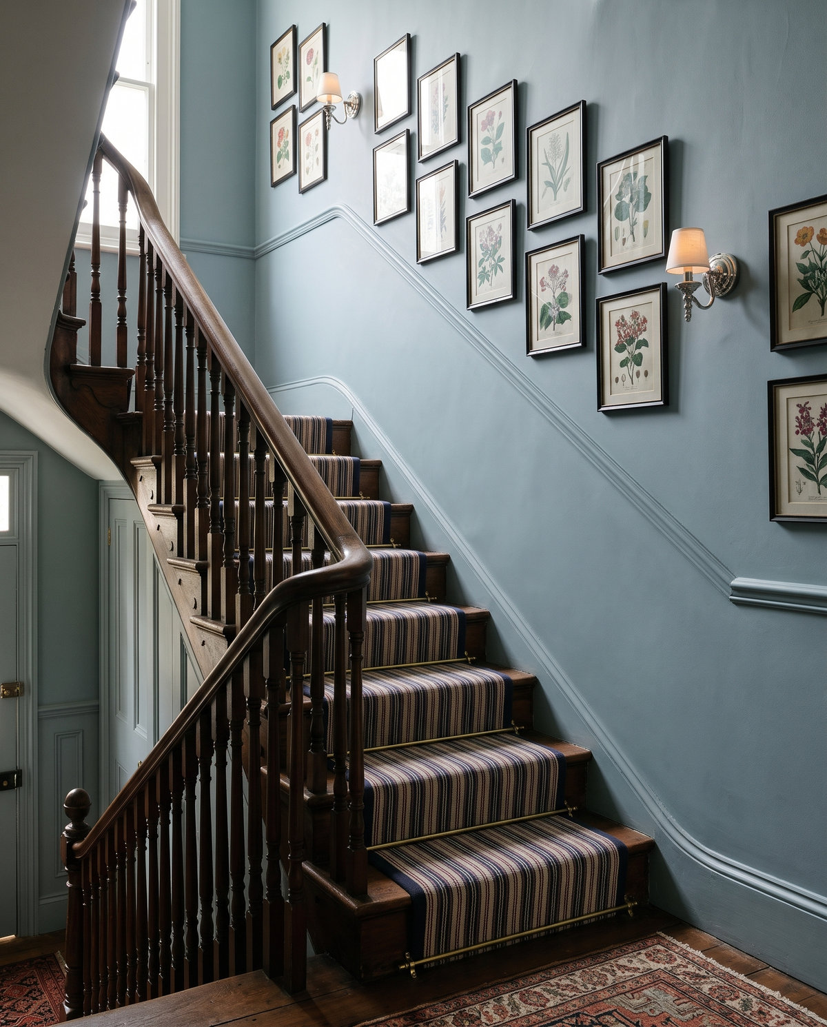 Candlewick sconces in Polished Nickel with shades along a Victorian staircase