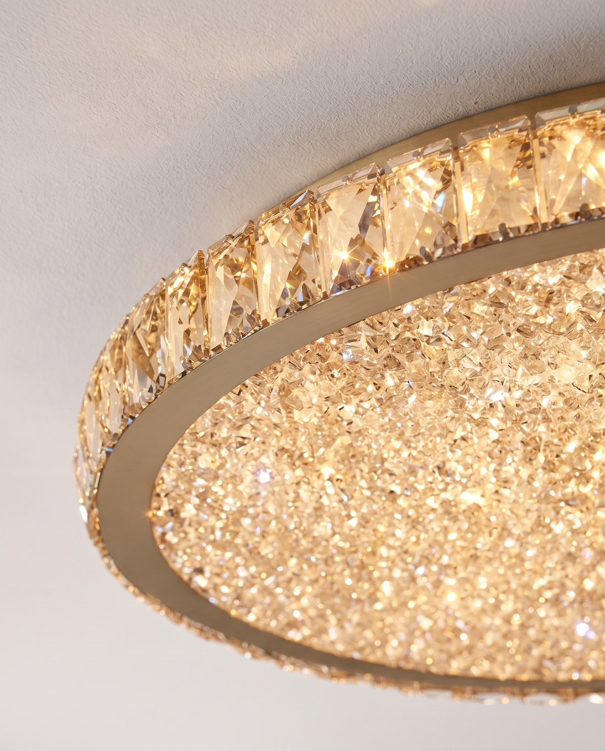 Close-up of the faceted crystal ring and textured diffuser of The Coronet