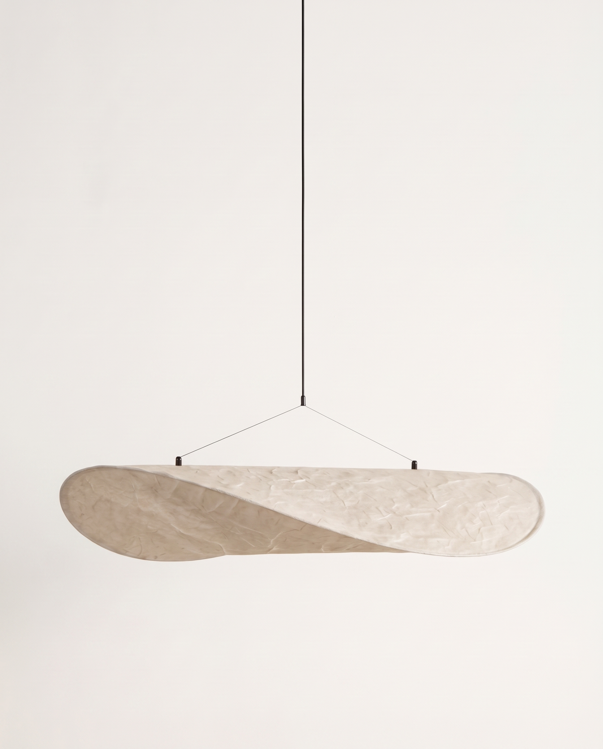 The Drift unlit in daylight, showing its creased paper