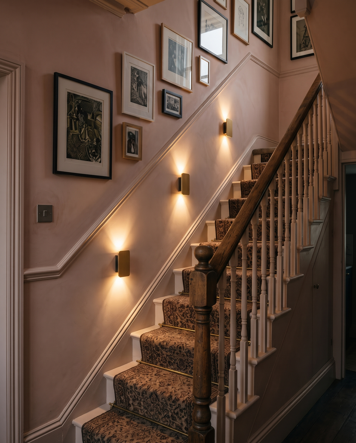 Three Folio wall lights in Gilt up the staircase of a Victorian terrace